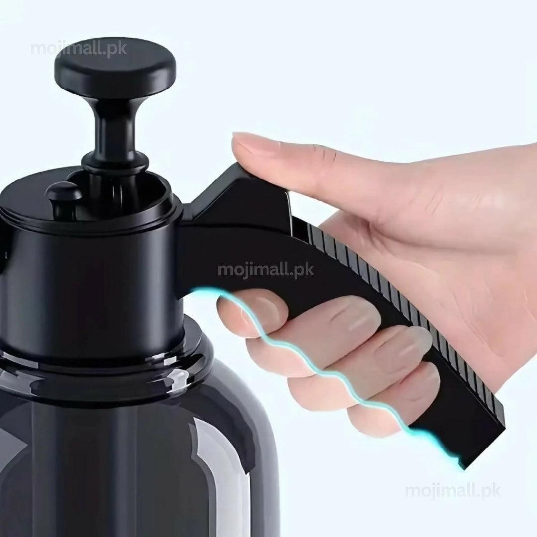 Compact black 2L hand pump garden sprayer with an adjustable nozzle for indoor and outdoor plant care by Moji Mall Pakistan.