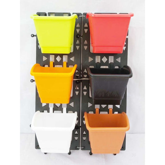 Wall-mounted plant pot holder with colorful pots on a white background