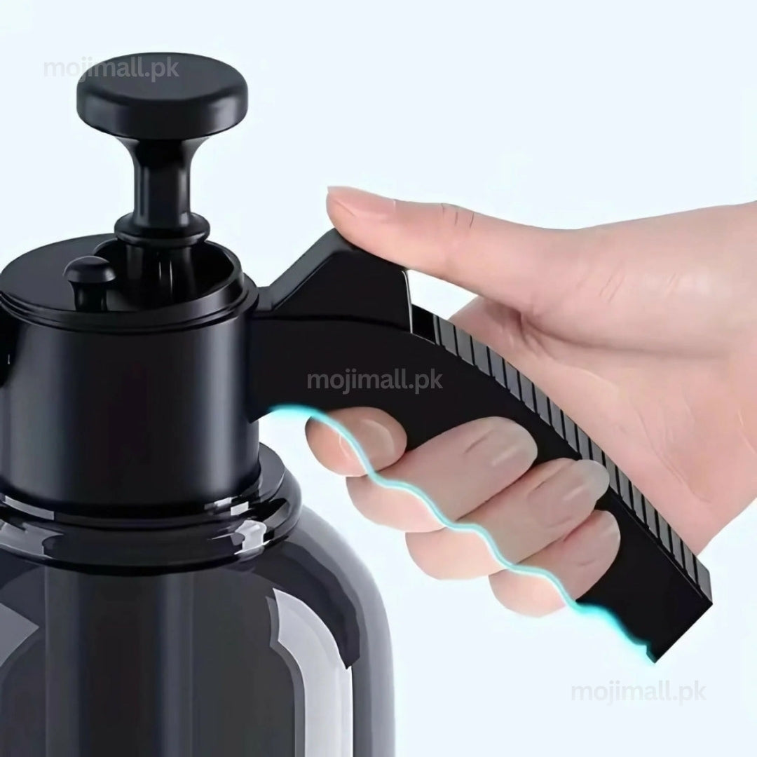 Compact black 2L hand pump garden sprayer with an adjustable nozzle for indoor and outdoor plant care by Moji Mall Pakistan.