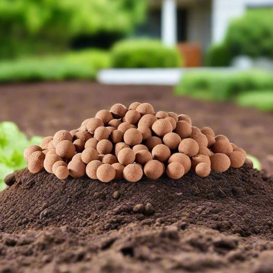 clay balls on a pile of soil with a garden background